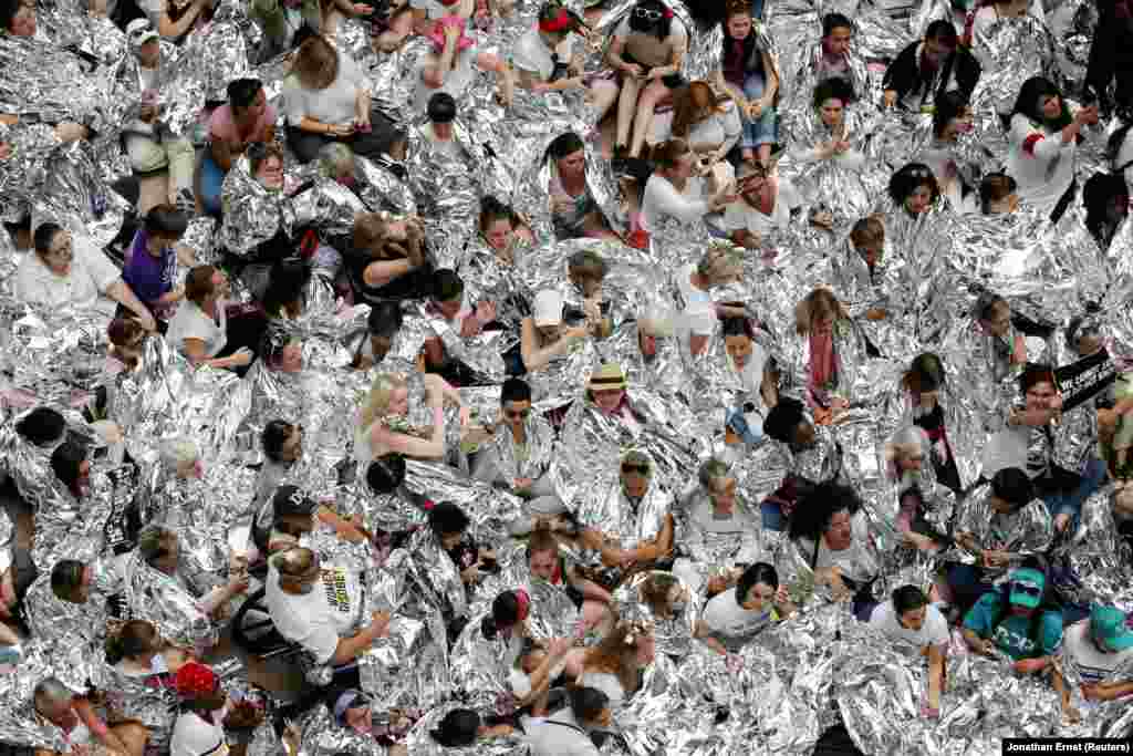 Immigration activists wrapped in silver blankets, symbolizing immigrant children that were seen using similar blankets at a U.S.-Mexico border detention facility in Texas, protest inside the Hart Senate Office Building after marching to Capitol Hill in Washington on June 28. (Reuters/Jonathan Ernst)