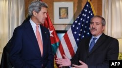 U.S. Secretary of State John Kerry (left) was accompanied on his trip to a Syrian refugee camp by Jordan's Foreign Minister Nasser Judeh (right).