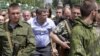 Оккупированный Донецк. Александр Захарченко (в центре), главарь группировки «ДНР», которая признана в Украине террористической (архивное фото)