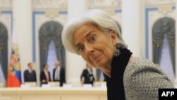 International Monetary Fund Managing Director Christine Lagarde takes her seat waiting for Russian President Vladimir Putin during a meeting of G20 finance ministers in the Kremlin in Moscow on February 15.