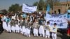 Afghans attend a rally in Herat to support the Doha peace talks between the Taliban and the Afghan government on September 21.