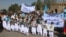 Afghans rally in Herat to support the Doha peace talks between Taliban and the Afghan government on September 21. 