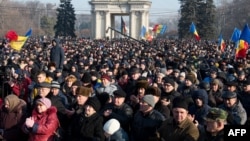 Protesters attend a rally in front of the parliament building in Chisinau on January 21.