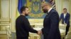 Ukrainian President Volodymyr Zelenskiy (left) shakes hands with British Foreign Secretary James Cleverly in Kyiv on June 5.
