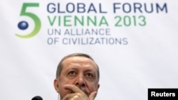 Turkish Prime Minister Tayyip Erdogan listens during a news conference after the opening session of the fifth United Nations Alliance of Civilizations (UNAOC) Forum in Vienna on February 27.