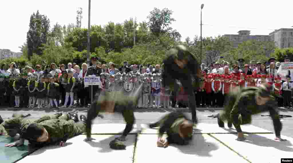 A performance by members of a youth military-patriotic club.