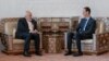 Syrian President Bashar al-Assad (right) meets with Iranian Foreign Minister Mohammad Javad Zarif in Damascus on April 16, 2019.