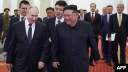Vladimir Putin (left) and North Korean leader Kim Jong Un attend a gala concert during the Russian president's visit to Pyongyang on June 19. 