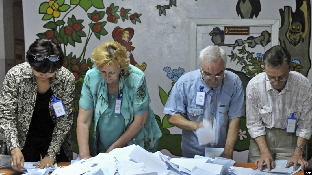 Election officials count votes at a polling station in Bishkek during a 2009 ballot in Kyrgyzstan.