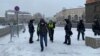 Yury Lebedev and a cameraman cover a rally in support of Aleksei Navalny in Moscow in 2021.