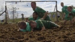 Russian Athletes Slog For Glory In Swamp Football