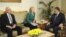 Egypt's Foreign Minister Mohamed Kamel Amr (left to right), U.S. Secretary of State Hillary Clinton, and Egyptian President Muhammad Morsi meet at the presidential palace in Cairo on November 21.