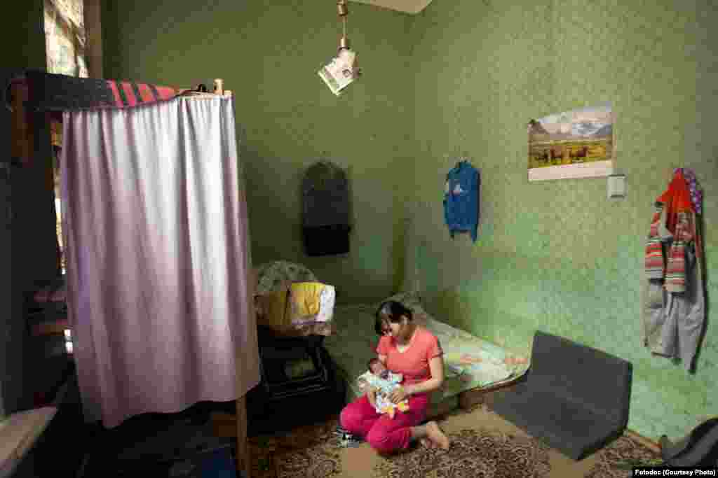 A young mother with a premature baby. The child spent two weeks under the supervision of doctors. The mother could not see him during that time because she was unregistered. St. Petersburg, 2011. Photo by Anna Laurinavichyute.