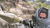 A Pakistani Taliban wields a rocket-propelled grenade launcher near Buner in mid-April.