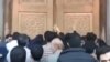 Iran - Qom - worshipers try to storm shrine closed because of coronavirus - screen grab