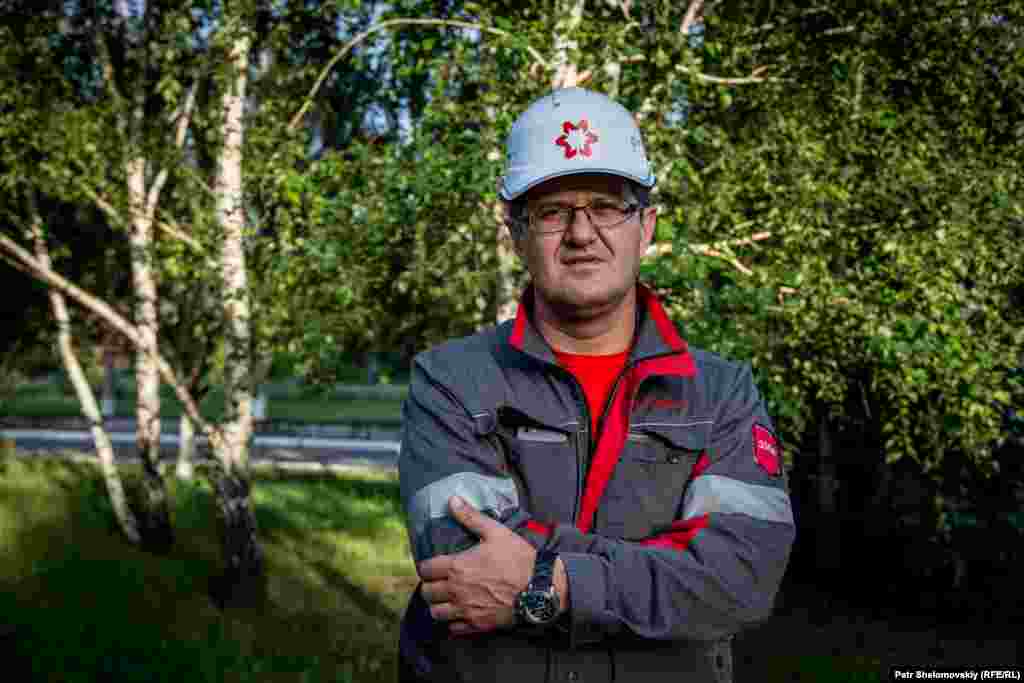 Coke plant manager Musa Magomedov stands by birch trees near the factory entrance. "The last two times we were shelled, it seemed to me we were the target... everything fell right inside the plant, nothing outside, it was very accurate."
