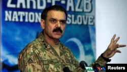 Lieutenant General Asim Bajwa, the Pakistani military's top spokesman, speaks during a news conference in Rawalpindi on September 1.