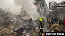 Ukrainian rescuers work at the site of a Russian missile strike on Poltava on February 1. 