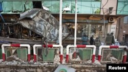 Afghanistan -- A view of the damaged entrance of the City Center shopping mall after a suicide bomb attack, in Kabul, 14Feb2011