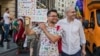 Victor Ciobotaru (left) and Florin Buhuceanu attend a gay-pride march in Bucharest in June.