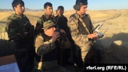 First Vice President Abdul Rashid Dostum observes a military operation in Faryab Province on August 11.