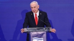 A video grab taken from UGC images posted on social media on February 28 and verified by AFP shows people inspecting the damage at an impact site following US and Israeli strikes on Tehran.