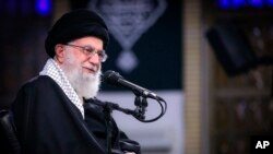 In this picture released by an official website of the office of the Iranian supreme leader, Supreme Leader Ayatollah Ali Khamenei attends a meeting with a group of the air force staff in Tehran, Iran, Friday, Feb. 8, 2019. Khamenei is defending "Death to