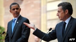 French President Nicolas Sarkozy (left) told his U.S. counterpart, Barack Obama, that France is "not waging war against Afghanistan."