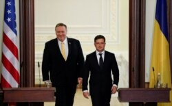 Ukrainian President Volodymyr Zelensky (right) and U.S. Secretary of State Mike Pompeo arrive to attend a joint news conference in Kyiv on January 31.