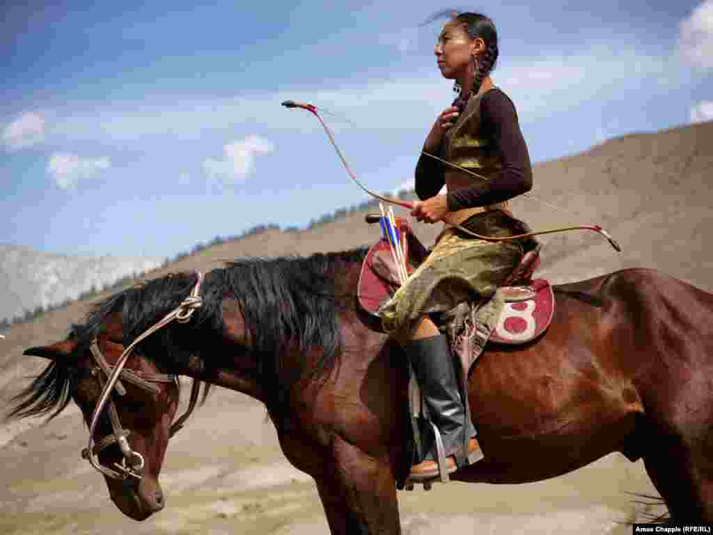 Aida Akhmatova, from Kyrgyzstan, awaits her run in mounted archery. The contest stipulates that riders wear their nation&#39;s traditional dress, firing arrows from horseback at three targets along a 120-meter track.