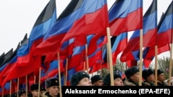 Students of a military school stand in formation before a march marking Flag Day of the self-proclaimed Donetsk People's Republic in the city of Donetsk.