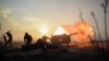 Ukrainian servicemen fire a howitzer close to the front line near the village of Novoluhanske in the Donetsk region on January 11.