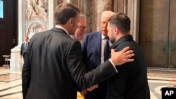 Ukrainian President Volodymyr Zelenskyy, (right) huddles with US President Donald Trump (second right) French President Emmanuel Macron (left), and British Prime Minister Keir Starmer at the funeral of Pope Francis at the Vatican on April 26.