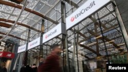 FILE - In this file photo dated Tuesday, Dec. 13, 2016, the entrance of the UniCredit tower at the Porta Nuova business district in Milan, Italy.