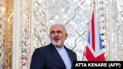 Iran's Foreign Minister Mohammad Javad Zarif waits to meet his British counterpart upon the latter's arrival in the capital Tehran on November 19, 2018.