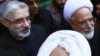 Opposition leaders Mir Hossein Musavi (left) and Mehdi Karrubi in Qom in December 2009