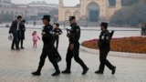 Security personnel patrol near the Id Kah Mosque in Kashgar in western China's Xinjiang region. (file photo)