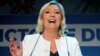 French far-right leader Marine Le Pen reacts after her party's strong showing in EU parliamentary elections on May 26. 