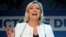 French far-right leader Marine Le Pen reacts after her party's strong showing in EU parliamentary elections on May 26. 