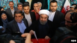 Iranian President Hassan Rohani (casting his vote in May 2017) cannot seek reelection after having served two consecutive four-year terms.