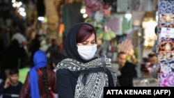 IRAN RAMADAN -- An Iranian woman walks at the Grand Bazaar market in the capital Tehran on April 20, 2020, as the threat of the COVID-19 pandemic lingers ahead of the Muslim holy month of Ramadan.