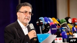 Iranian reformist politician Mostafa Tajzadeh addresses the media in May 2021.