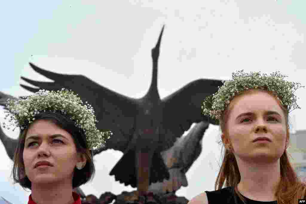 Two women in traditional headgear take part in the protest on Independence Square.&nbsp;