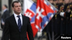 Russian President Dmitry Medvedev walks past a guard of honor upon his arrival in Bratislava.