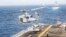 A U.S. Marine helicopter takes off from the flight deck of the U.S. Navy amphibious-assault ship USS Boxer during its transit through the Strait of Hormuz in the Gulf of Oman in July.