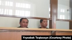 Murager Alimuly (right) and Qaster Musakhanuly were given one-year sentences for illegally entering the country, but were allowed to stay in Kazakhstan.