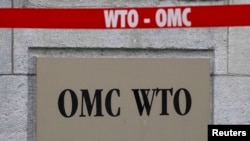 Табличка на здании Всемирной торговой организации в Женеве.