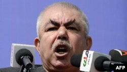 Afghanistan -- Afghan vice-presidential candidate Abdul Rahid Dostum, who is campaigning with presidential candidate Ashraf Ghani Ahmadzai, addresses the crowd during a gathering in the outskirts of Kunduz province, March 19, 2014