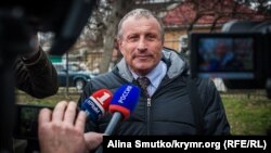 Mykola Semena speaks to reporters last month.