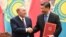 CHINA -- Kazakh President Nursultan Nazarbaev (L) shakes hands with Chinese President Xi Jinping during a signing ceremony in the Great Hall of the People in Beijing, June 7, 2018